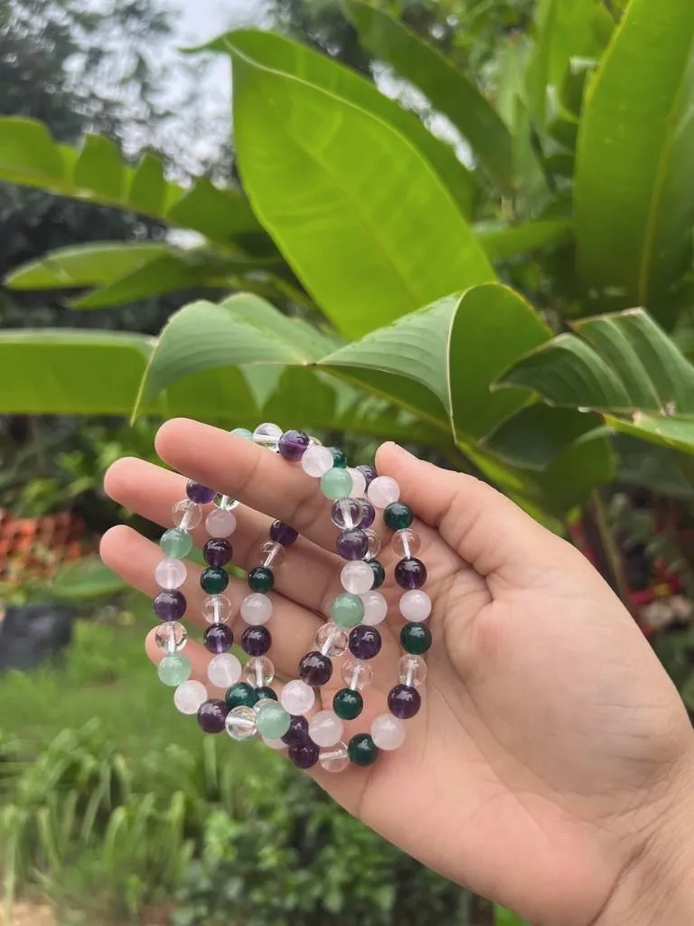 A beaded crystal bracelet resting in an open palm